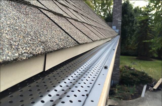 Miller and Rivas Roofing/Guttering LLC logo