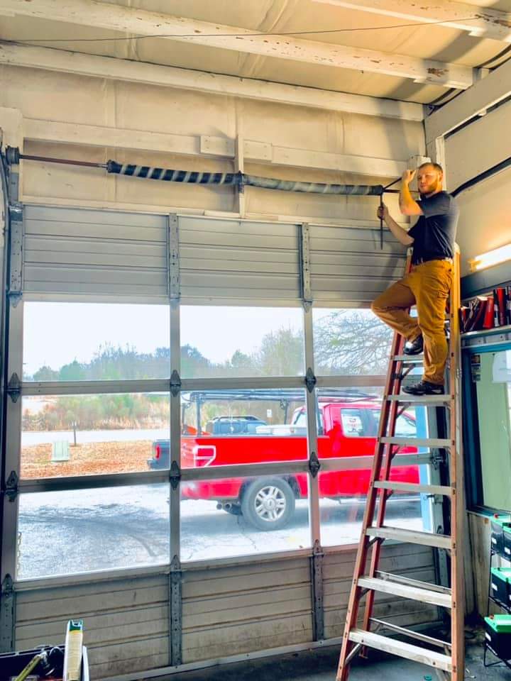 Ron's Garage Door Repair logo