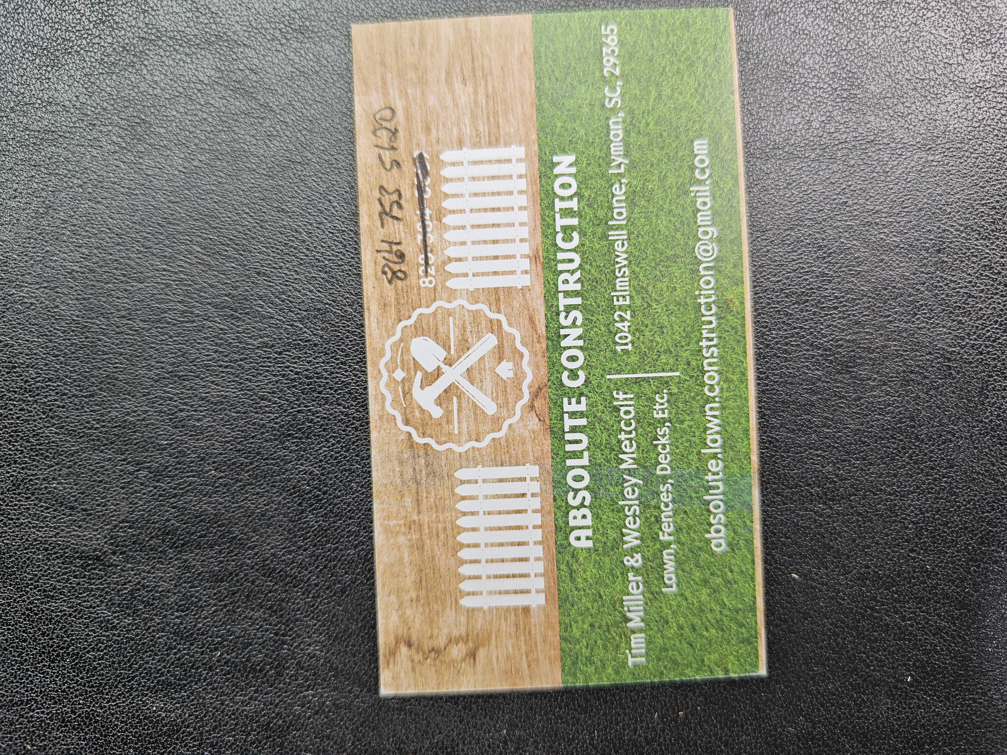 Absolute Construction and Landscaping logo