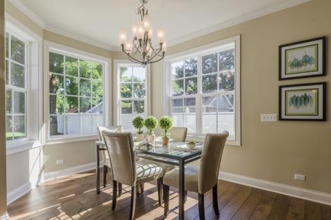 Transitional Dining Room with cream upholstered dining chairs