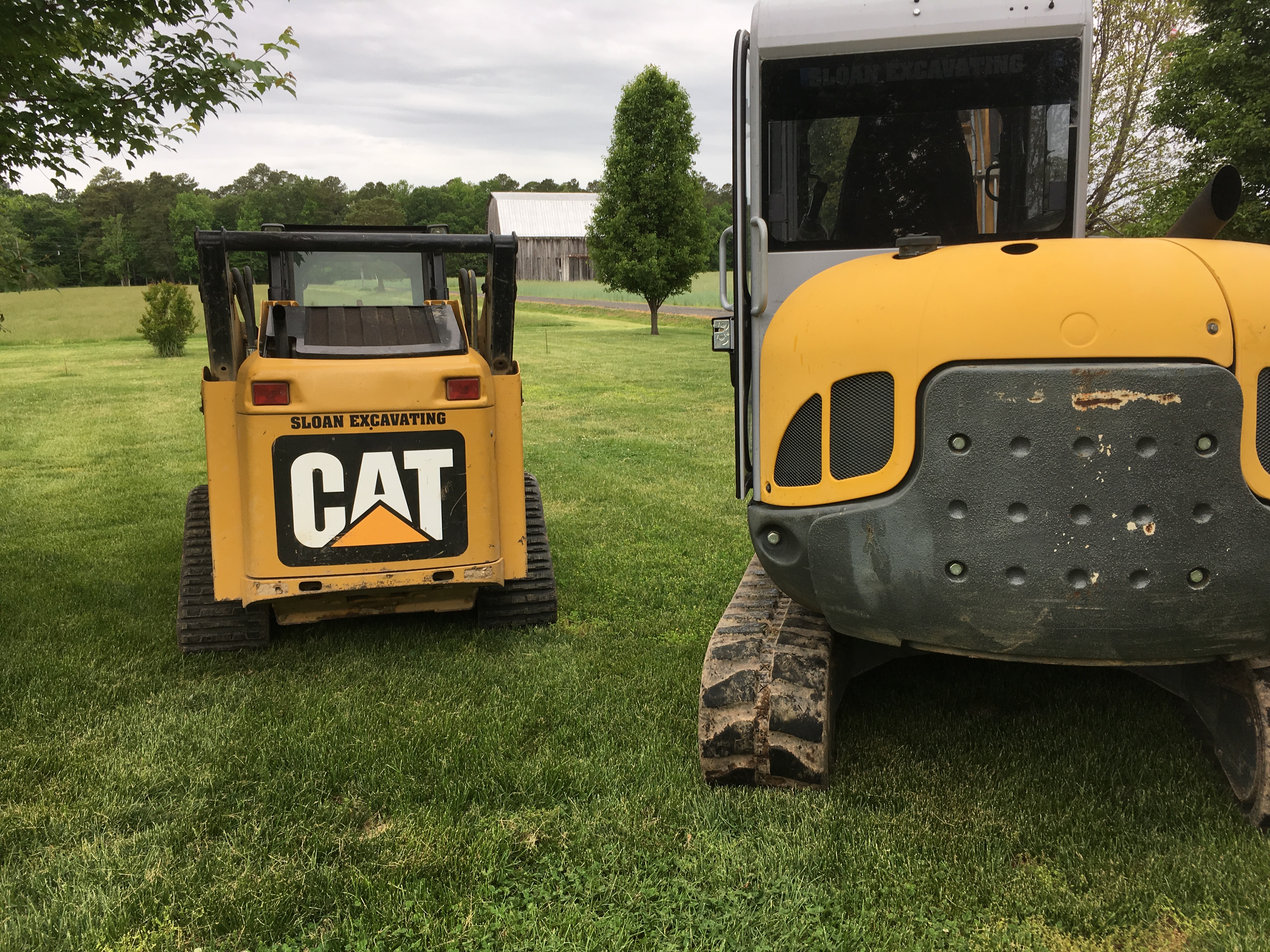 Sloan excavating logo