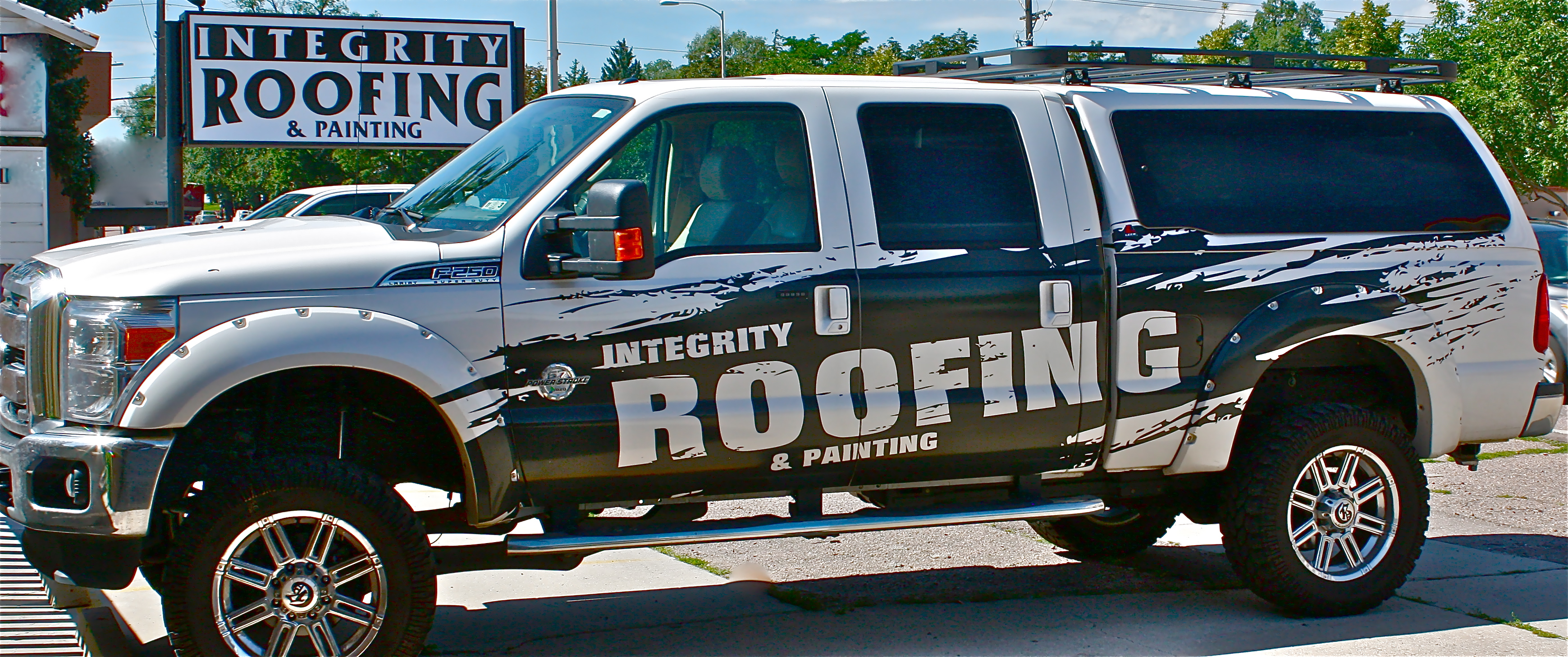Integrity Roofing & Painting logo