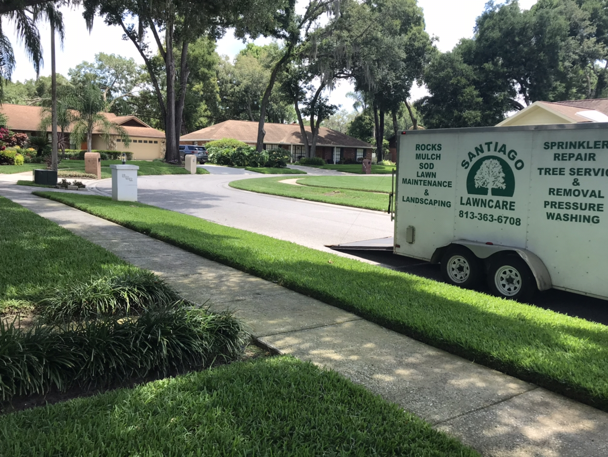 Santiago Lawn Care logo