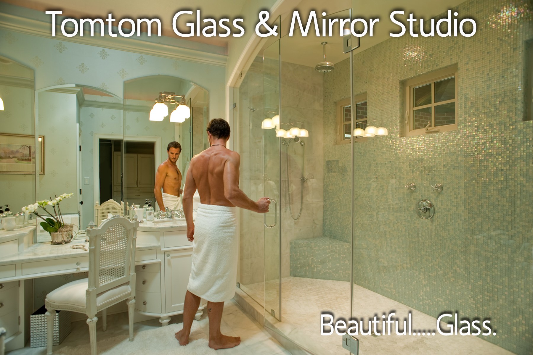 The TomTom Glass & Mirror Studio logo