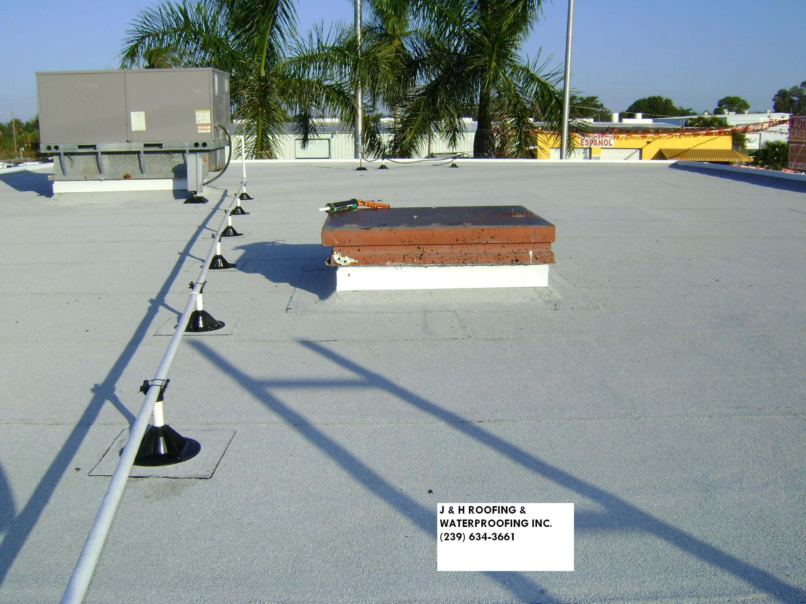 J and H Roofing logo