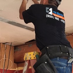 Logo for TH Electric