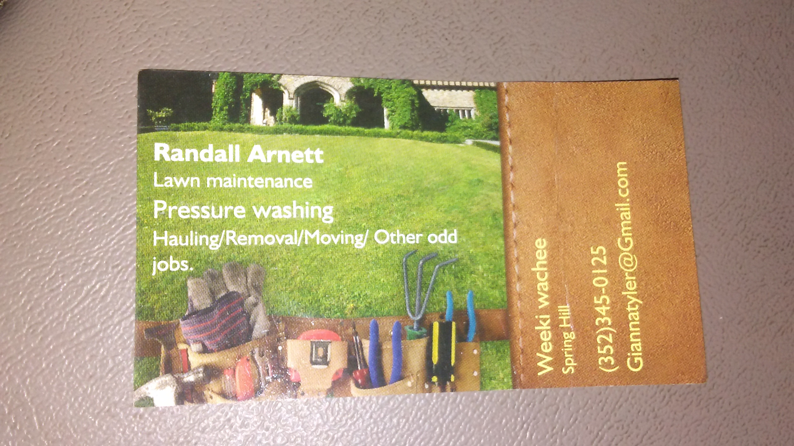 Randall Arnett Lawn Maintenance logo