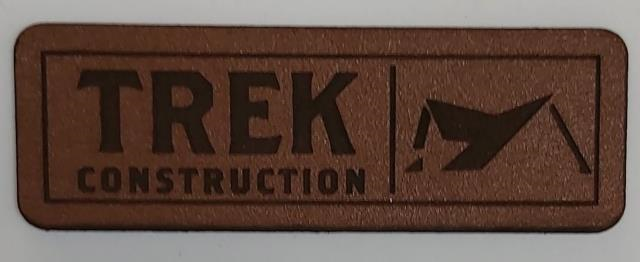 TREK CONSTRUCTION logo