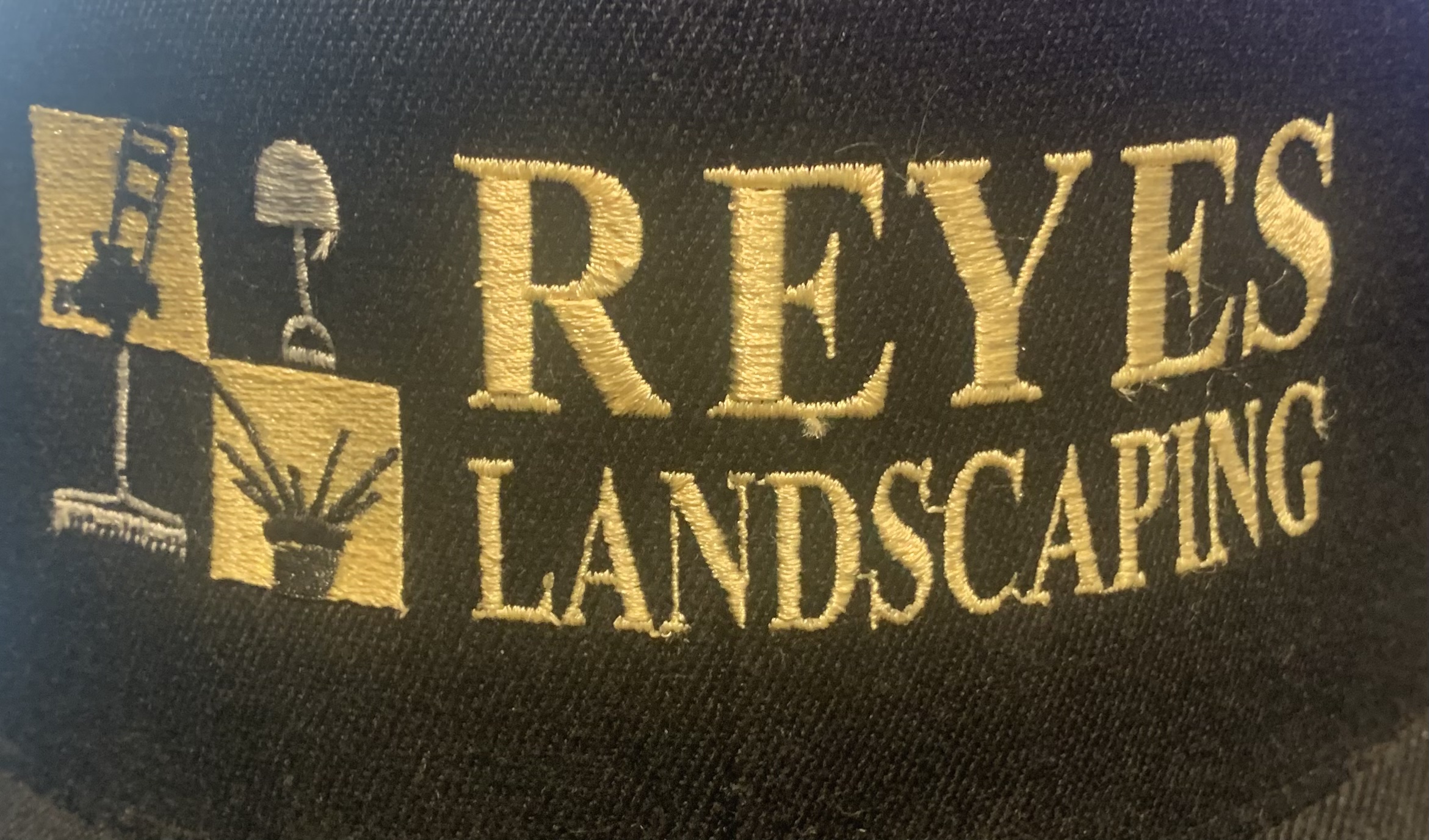 Reyes landscaping logo