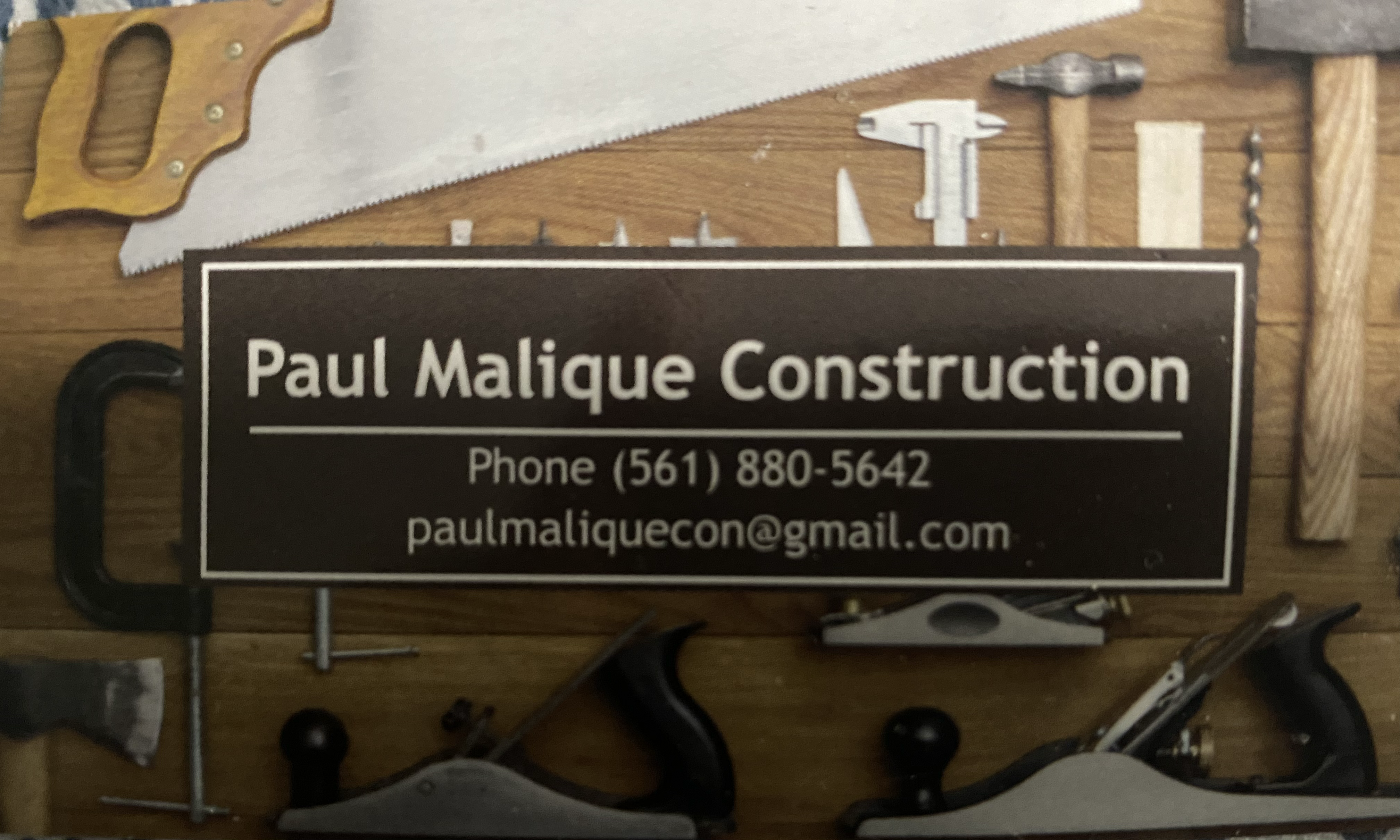 Logo for Paul Malique Construction