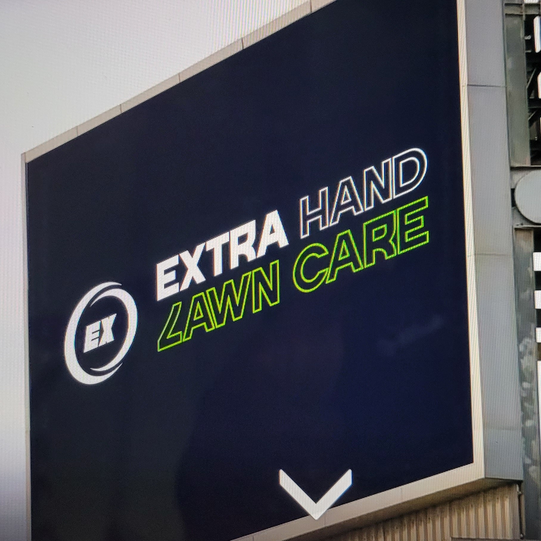 Extra Hand Lawn Care logo