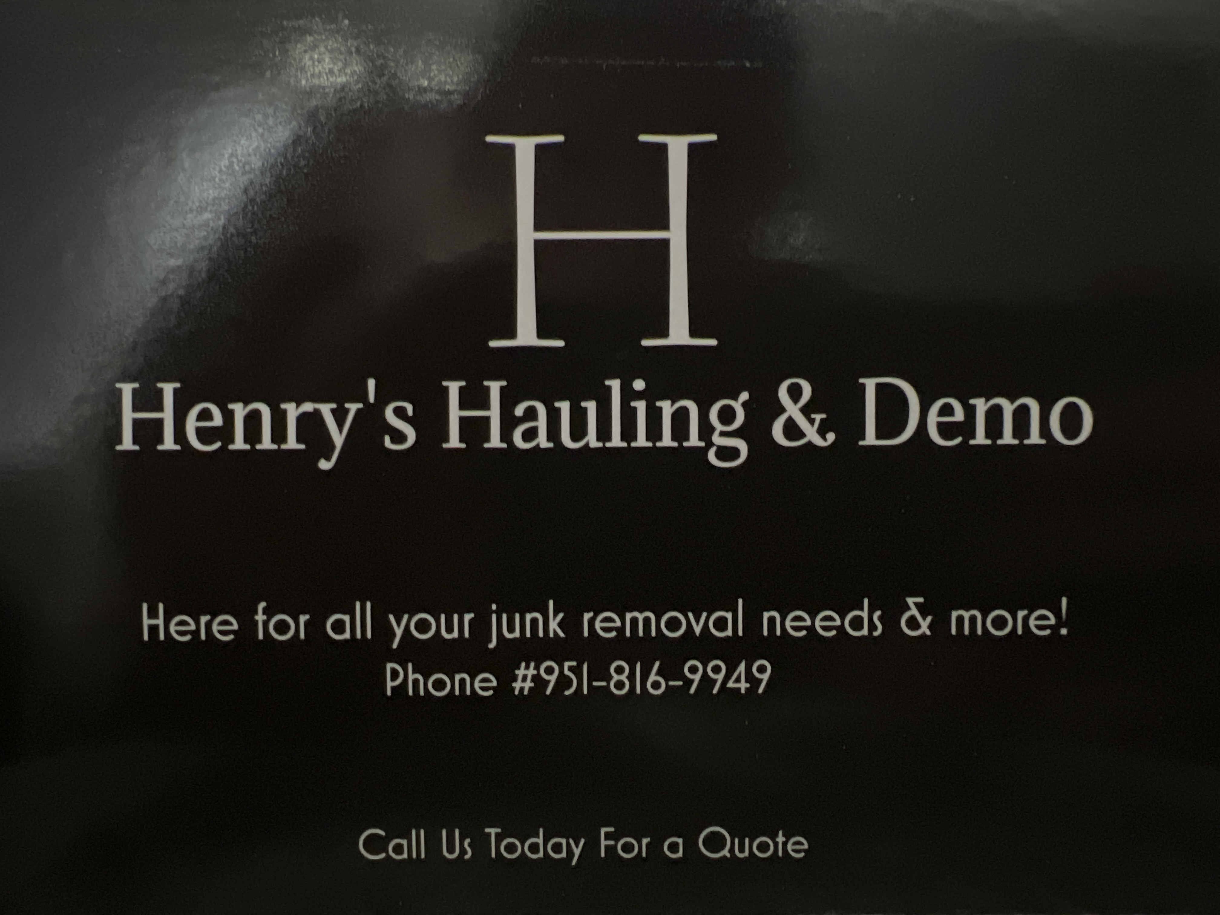 Henry's Hauling and Demo logo