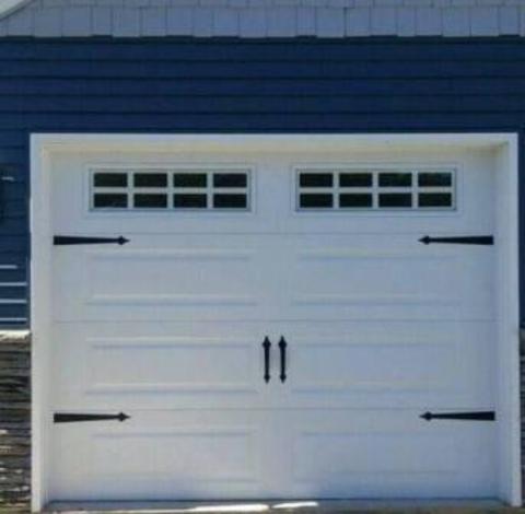 Transitional Garage with wrought iron garage door hardware