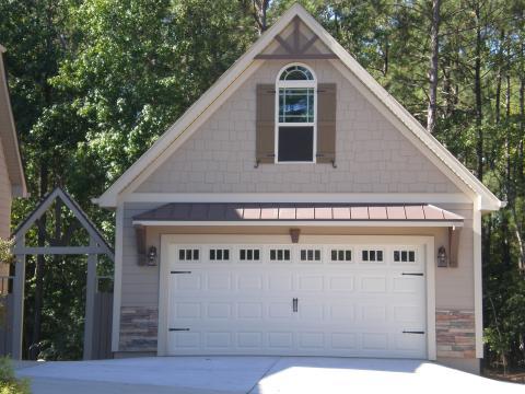 Arts & Crafts Garage with white framed windows and doors