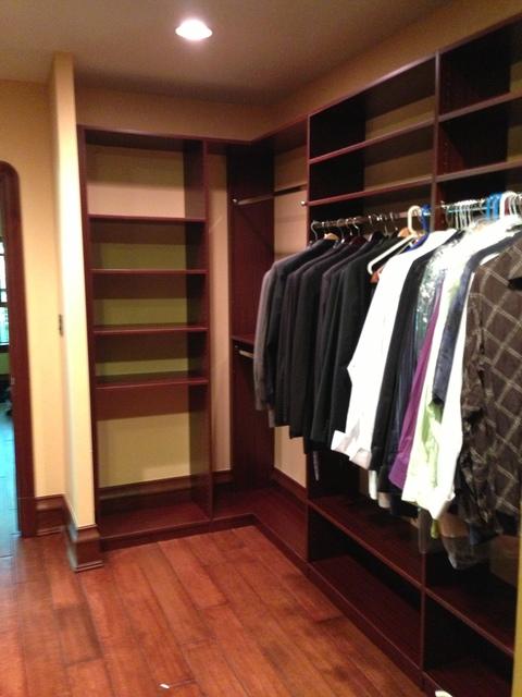 Traditional Closet with medium stained engineered hardwood floors