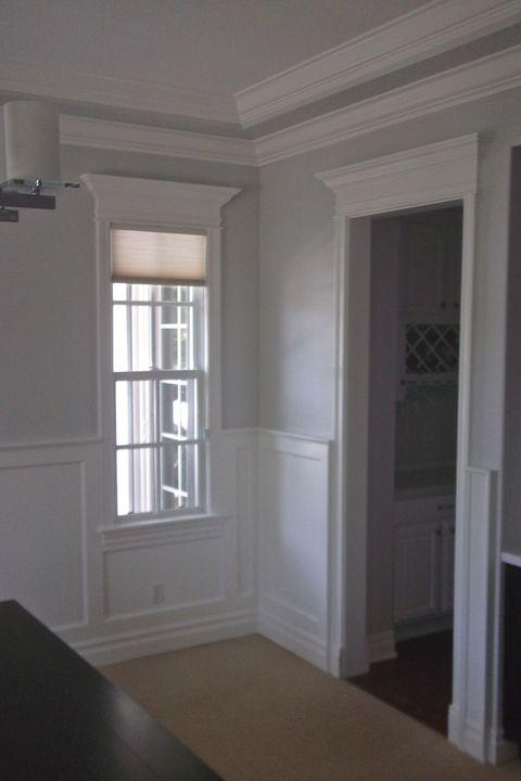 Traditional Dining Room with white crown molding