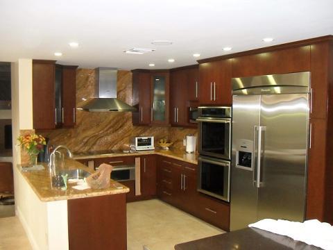 Modern Kitchen with granite backsplash and wall