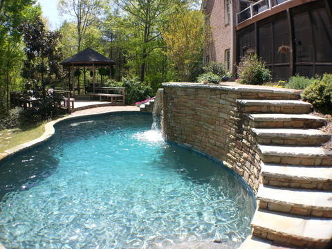 Traditional Pool with curved pool design