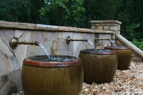 Transitional Landscape with unique outdoor water feature