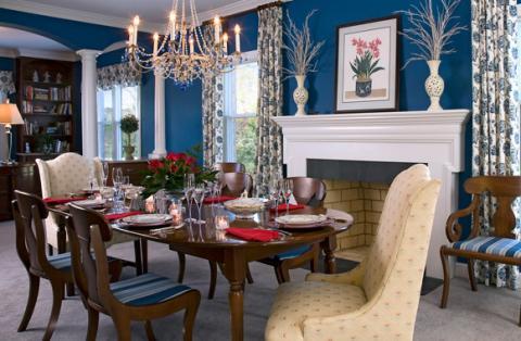 Transitional Dining Room with upholstered tulip wingback chair