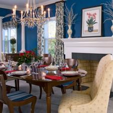 Transitional Dining Room with upholstered tulip wingback chair