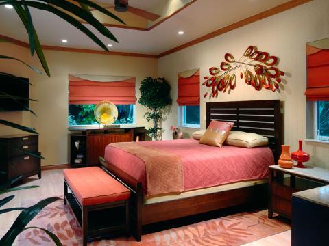 Eclectic Bedroom with coral and orange bed covers