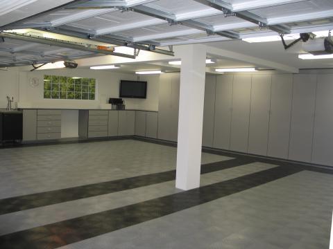Contemporary Garage with grey and black flooring