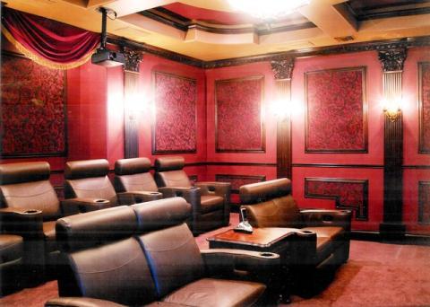 Traditional Home Theater with dark brown leather recliner chairs