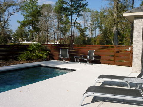 Contemporary Pool with varied size horizontal slat fence