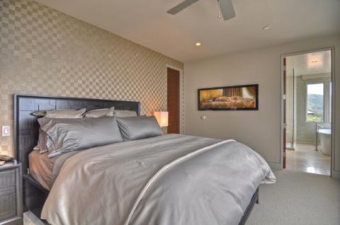 Contemporary Bedroom with patterned wallpaper