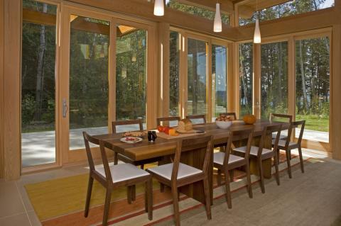 Transitional Dining Room with medium wood dining table and chairs