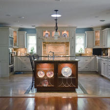 Traditional Kitchen with large kitchen island with dark wood cabinets