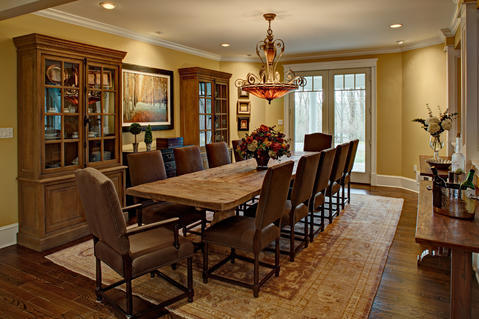 Transitional Dining Room with glass display cabinet doors