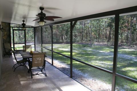 Contemporary Sunroom with large screened in patio