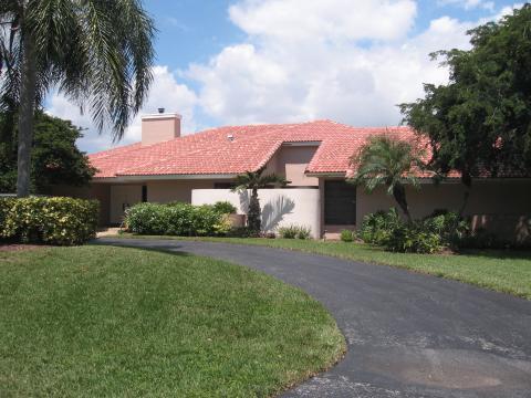 Southwestern Home Exterior with red spanish tile roofing