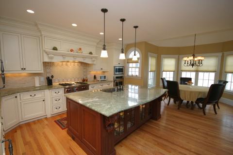 Traditional Kitchen with leather upholstered chairs