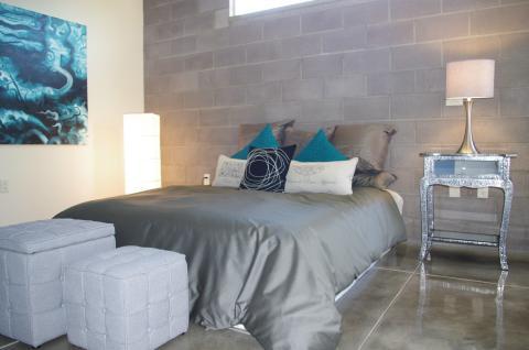 Contemporary Bedroom with painted cement flooring
