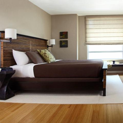 Contemporary Bedroom with wall sconces on sides of bed