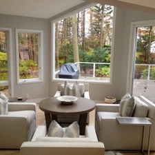 Contemporary Sunroom with mid-century modern armchairs