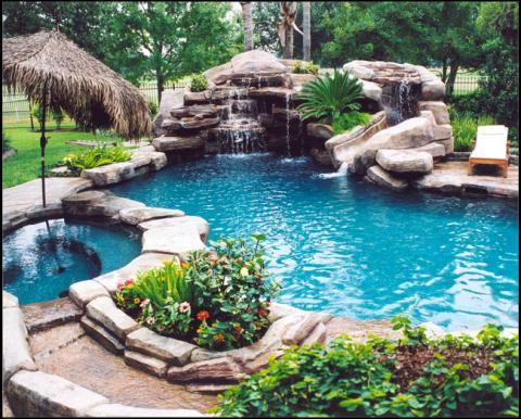 Transitional Pool with outdoor lounge chairs