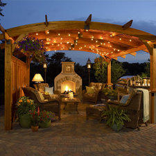 Traditional Patio with fire place and kitchen area under trellis