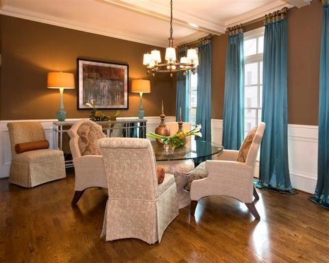 Eclectic Dining Room with upholstered mismatched dining chairs