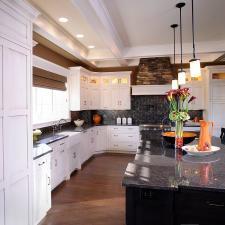 Transitional Kitchen with large kitchen island with black cabinets