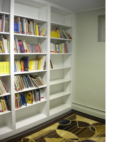 Traditional Library with white built in bookshelves