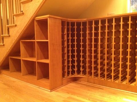 Modern Wine Cellar with wood stairs and railing