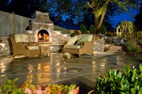 Transitional Patio with stone brick outdoor fire place