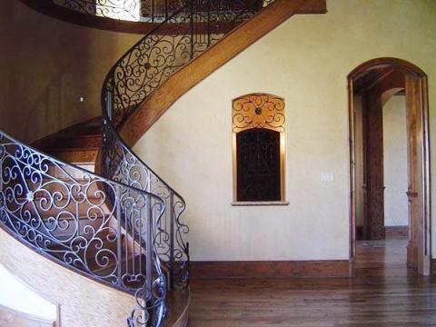 Traditional Staircase with black metal balusters