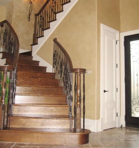 Traditional Staircase with dark wood front door with textures glass panel