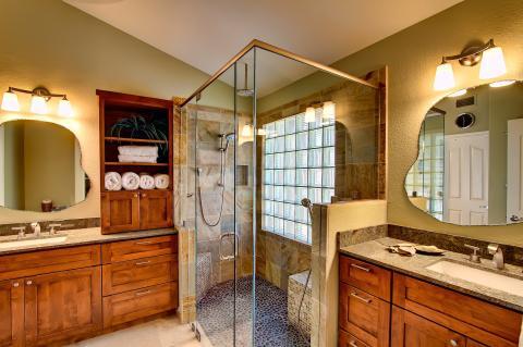 Transitional Bathroom with curvy wall mounted vanity mirror