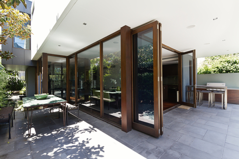Modern Home Exterior with glass framed folding doors